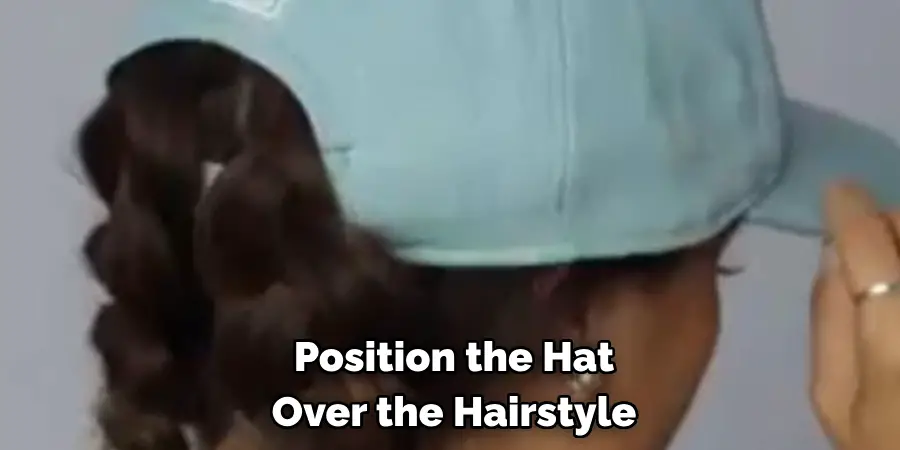 Position the Hat Over the Hairstyle