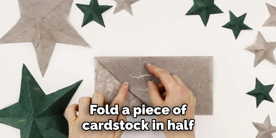 Fold a piece of cardstock in half