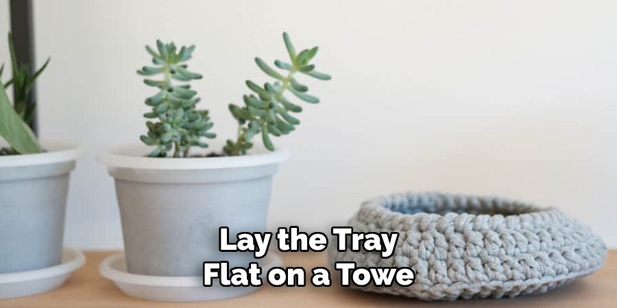 Lay the Tray Flat on a Towe