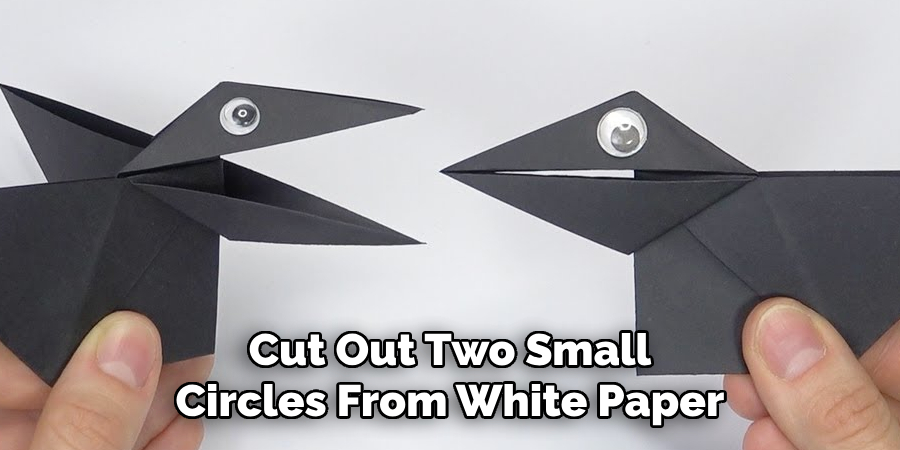 Cut Out Two Small Circles From White Paper