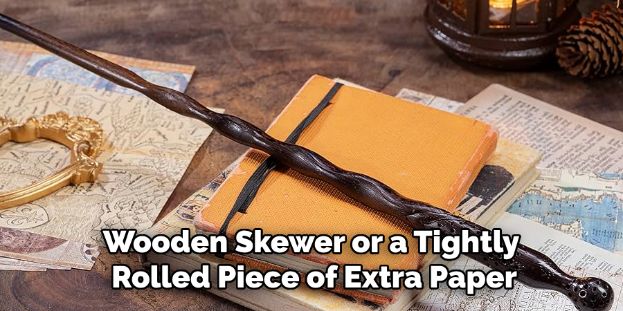 Wooden Skewer or a Tightly
Rolled Piece of Extra Paper