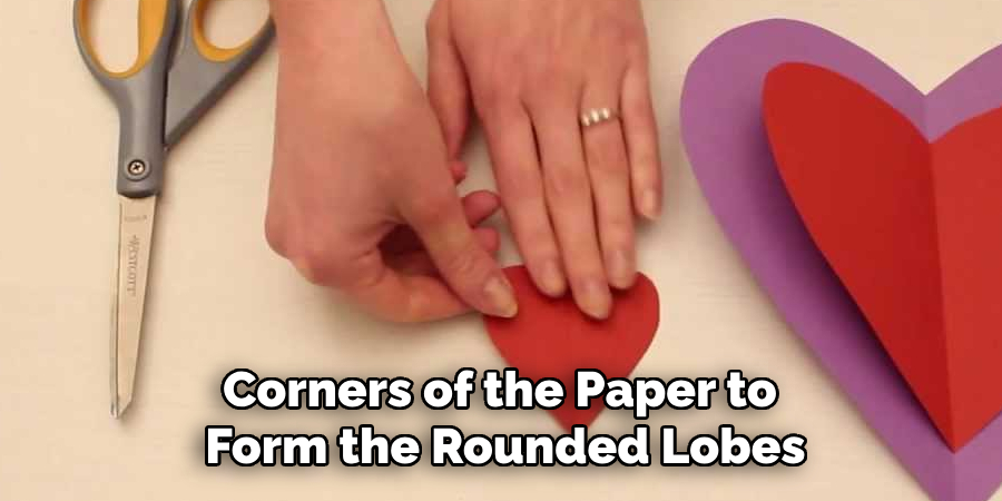 Corners of the Paper to
Form the Rounded Lobes