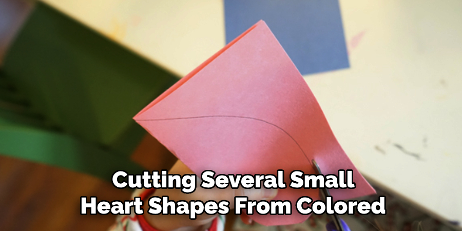 Cutting Several Small
Heart Shapes From Colored