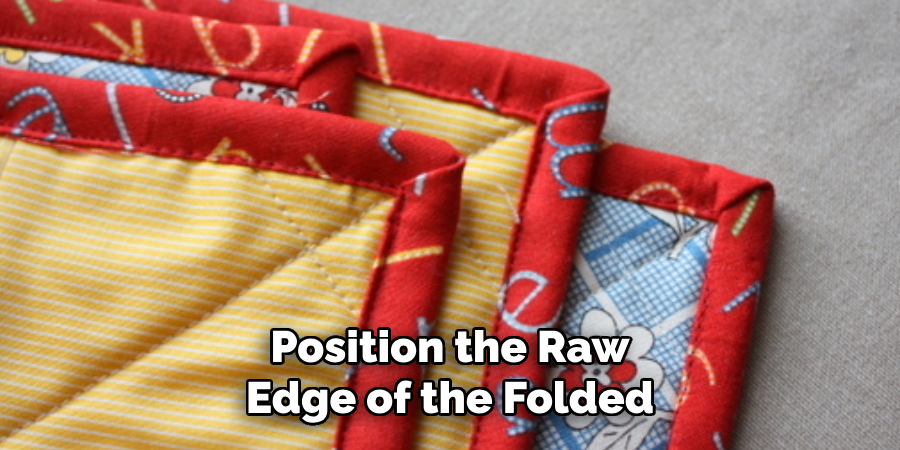 Position the Raw Edge of the Folded