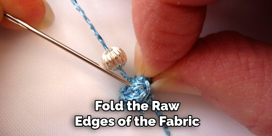 Fold the Raw Edges of the Fabric