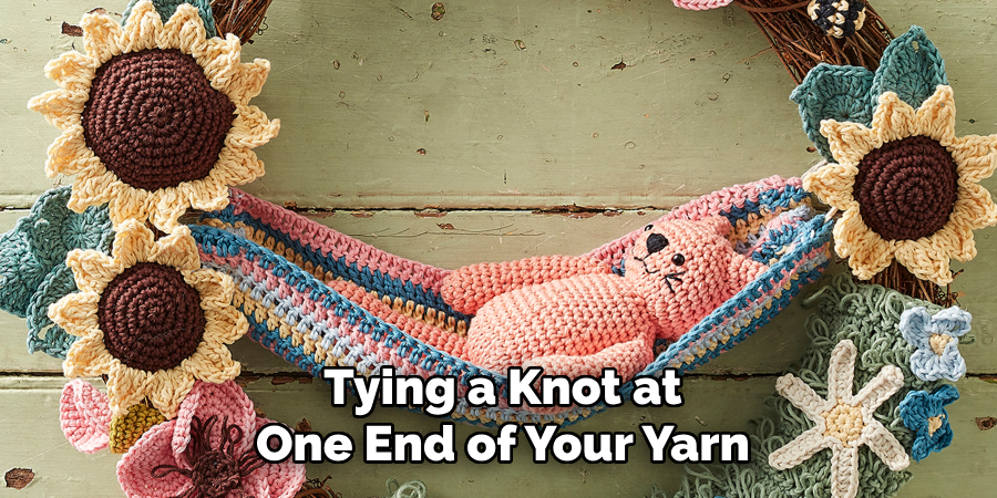 Tying a Knot at One End of Your Yarn
